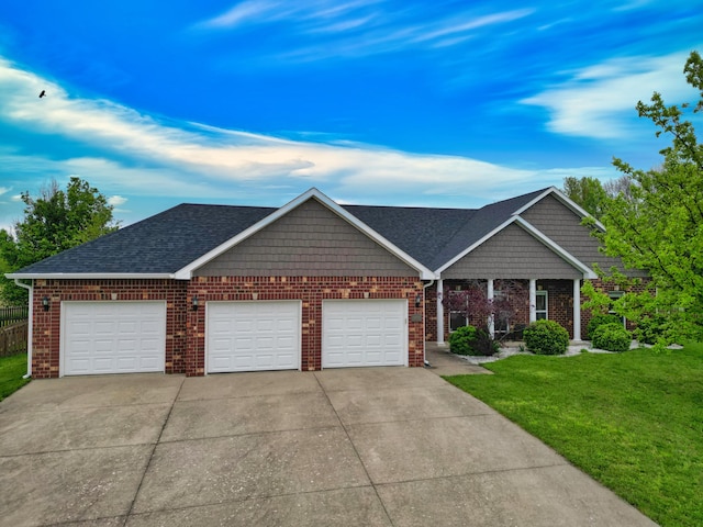 1600 Andretti Cir, Columbia, MO 65201 - view of front of house featuring an attached garage, concrete driveway, a front yard, brick siding, and roof with shingles