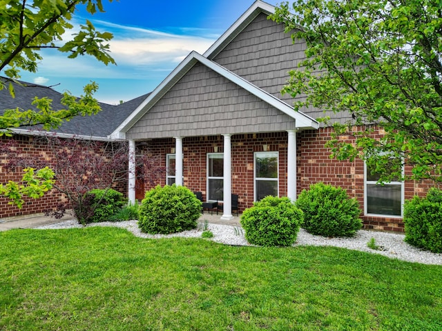 1600 Andretti Cir, Columbia, MO 65201 - view of front of house with a front lawn and brick siding
