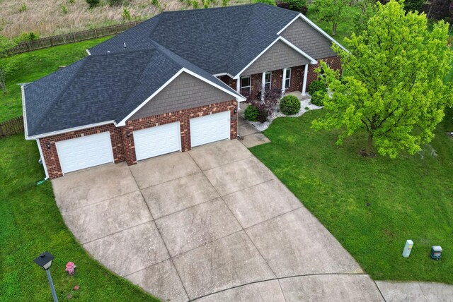 1600 Andretti Cir, Columbia, MO 65201 - view of front of house featuring brick siding, concrete driveway, a garage, and roof with shingles