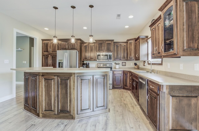 1600 Andretti Cir, Columbia, MO 65201 - kitchen featuring stainless steel appliances, a sink, light wood-style floors, light countertops, and recessed lighting