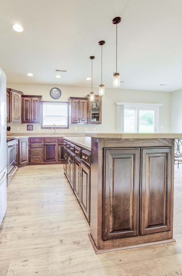 1600 Andretti Cir, Columbia, MO 65201 - kitchen featuring electric stove, healthy amount of natural light, a kitchen island, light countertops, and recessed lighting