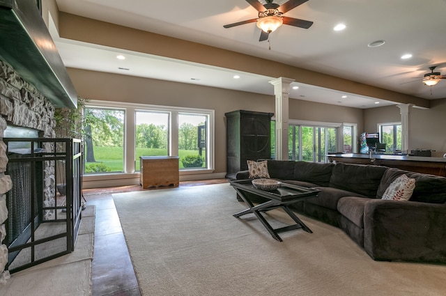 6507 Crooked Switch Ct, Columbia, MO 65201 - living area with a stone fireplace, ornate columns, a ceiling fan, and recessed lighting
