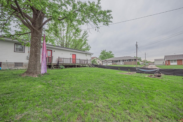 view of yard with a wooden deck