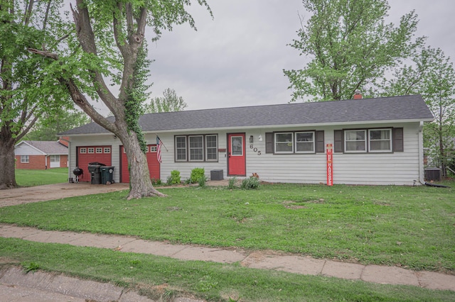 ranch-style house with concrete driveway, an attached garage, cooling unit, and a front lawn