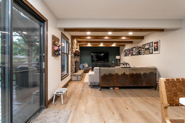living room featuring recessed lighting, beam ceiling, and hardwood / wood-style floors