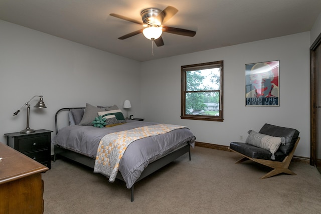 bedroom with baseboards, light carpet, and ceiling fan