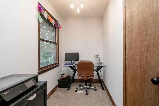 office space featuring carpet floors and baseboards