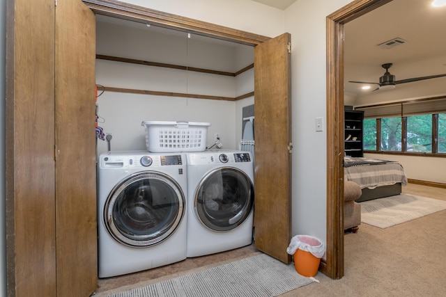 clothes washing area featuring laundry area, ceiling fan, separate washer and dryer, carpet, and visible vents