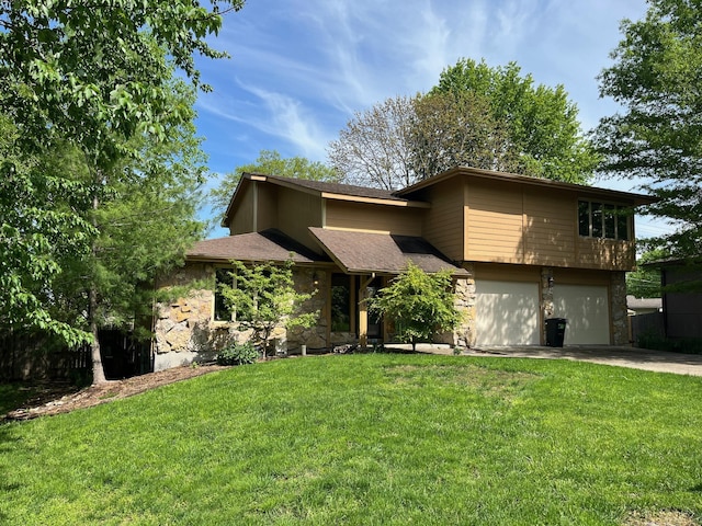 view of front of house with a front yard, driveway, stone siding, and a garage