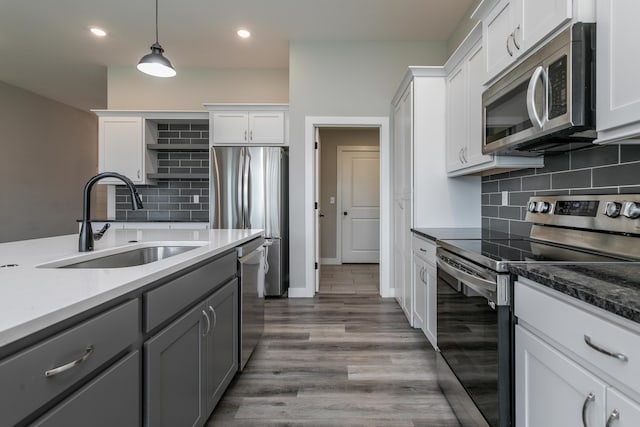 15070 Ada Dr, Hallsville, MO 65255 - kitchen with backsplash, a sink, gray cabinetry, stainless steel appliances, and recessed lighting