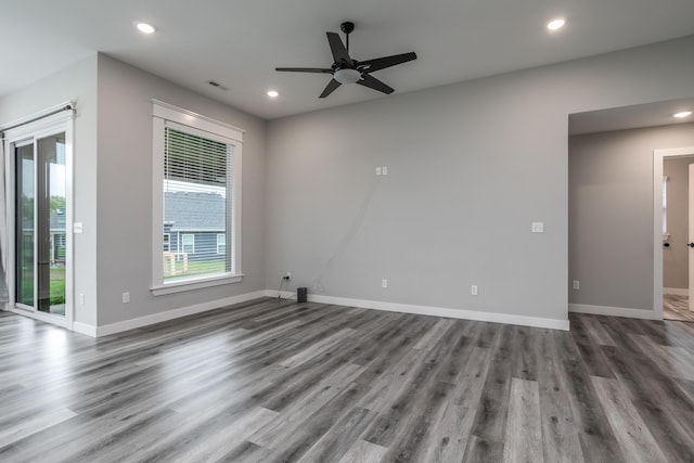15070 Ada Dr, Hallsville, MO 65255 - spare room with baseboards, recessed lighting, ceiling fan, and wood finished floors