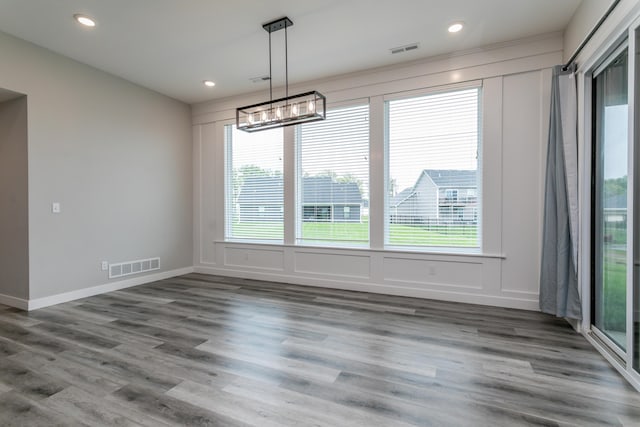 15070 Ada Dr, Hallsville, MO 65255 - unfurnished dining area with a healthy amount of sunlight, a chandelier, and visible vents
