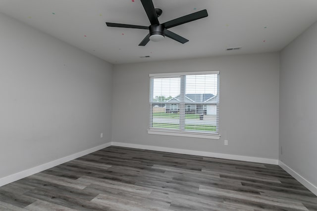 15070 Ada Dr, Hallsville, MO 65255 - empty room with baseboards, a ceiling fan, wood finished floors, and visible vents