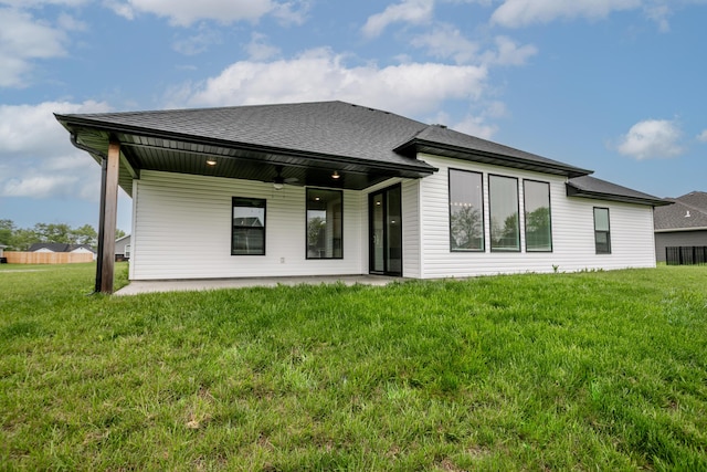 15070 Ada Dr, Hallsville, MO 65255 - rear view of property with a lawn and roof with shingles