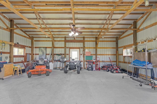 garage with metal wall and a ceiling fan