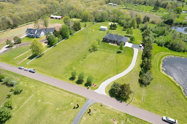 drone / aerial view with a water view and a rural view