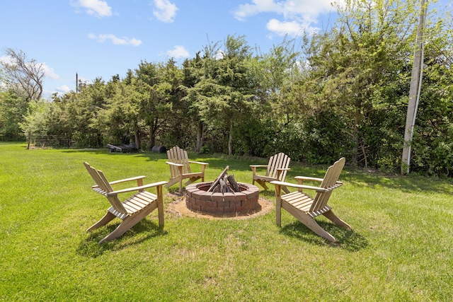 view of yard with a fire pit