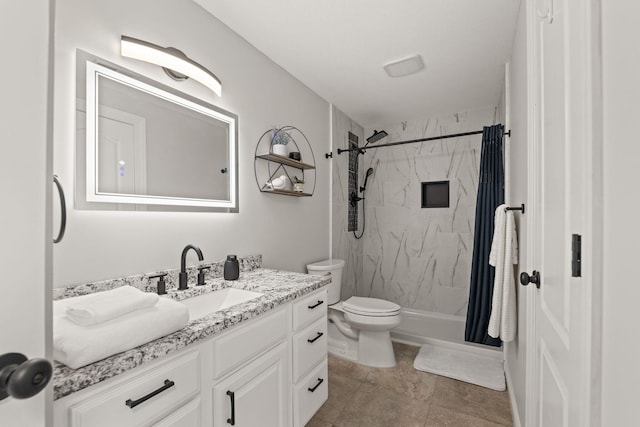 bathroom with vanity, toilet, and curtained shower