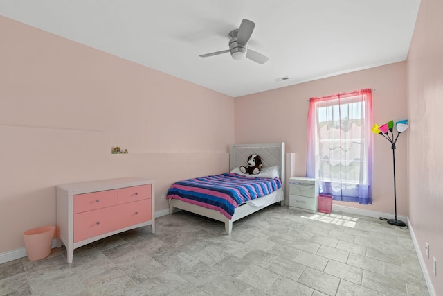 bedroom with baseboards, visible vents, and ceiling fan
