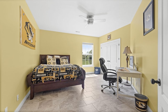 bedroom featuring baseboards, ceiling fan, and visible vents