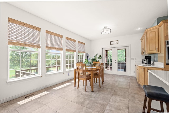 dining space with light tile patterned floors, french doors, recessed lighting, and visible vents