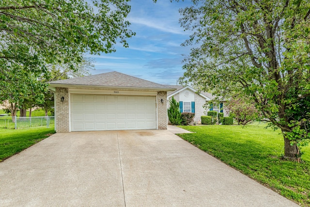 single story home featuring fence, concrete driveway, a front yard, and brick siding
