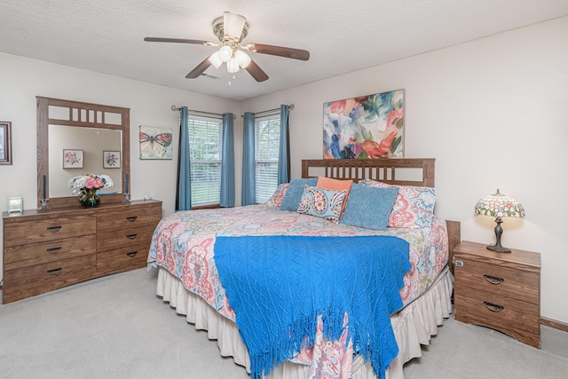 carpeted bedroom featuring a ceiling fan