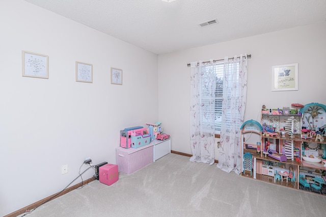 game room with carpet floors, baseboards, and visible vents