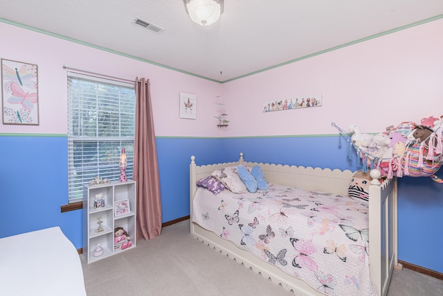 carpeted bedroom with visible vents and baseboards