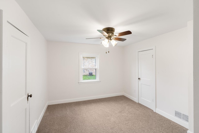 910 Kemper St, Boonville, MO 65233 - carpeted empty room with a ceiling fan and baseboards