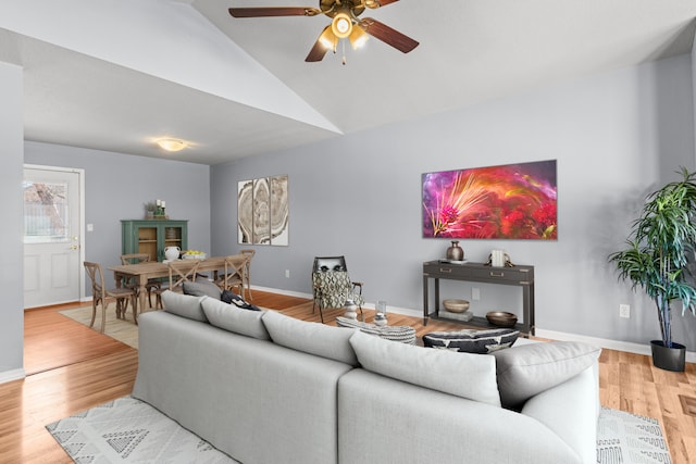 5650 N Autumn Dr, Columbia, MO 65202 - living room featuring baseboards, ceiling fan, wood finished floors, and high vaulted ceiling