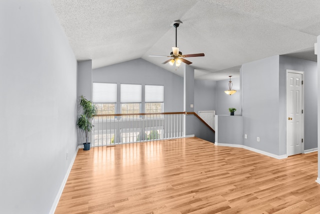 5650 N Autumn Dr, Columbia, MO 65202 - interior space featuring a textured ceiling, ceiling fan, baseboards, and wood finished floors