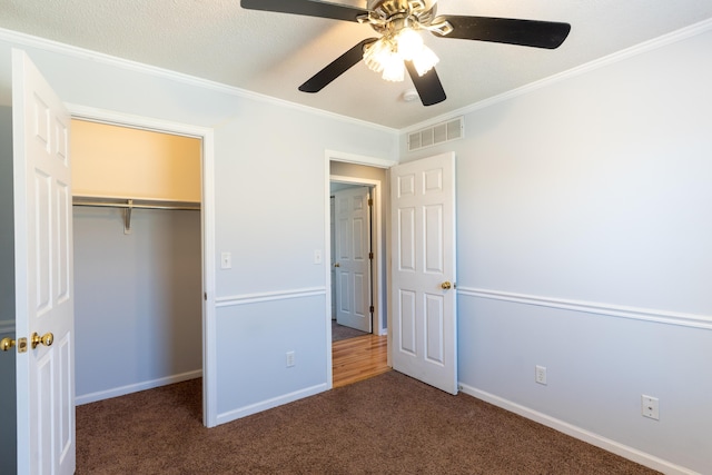 5650 N Autumn Dr, Columbia, MO 65202 - unfurnished bedroom featuring carpet flooring, baseboards, visible vents, ornamental molding, and a closet