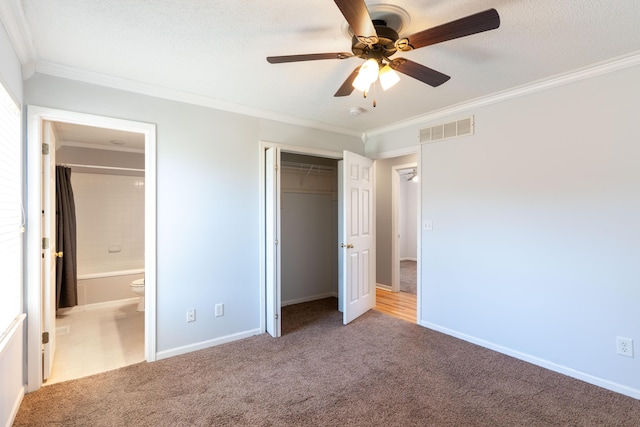 5650 N Autumn Dr, Columbia, MO 65202 - unfurnished bedroom with crown molding, baseboards, visible vents, and carpet floors