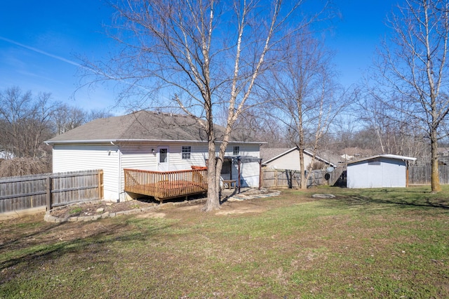 5650 N Autumn Dr, Columbia, MO 65202 - view of yard with an outdoor structure, a fenced backyard, a storage unit, and a deck
