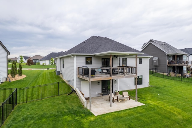 rear view of house with a fenced backyard, a lawn, a patio area, and cooling unit
