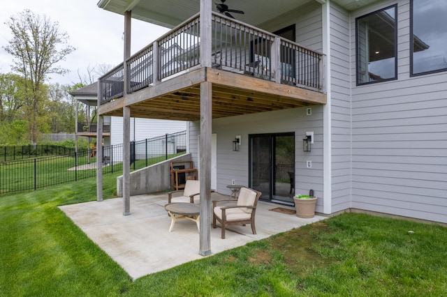 view of patio / terrace with a ceiling fan and fence