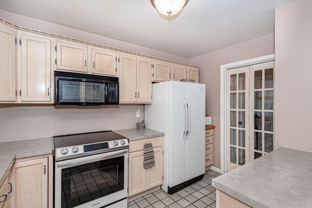 3005 Meghann Dr, Columbia, MO 65203 - kitchen with freestanding refrigerator, light brown cabinets, black microwave, light countertops, and electric stove