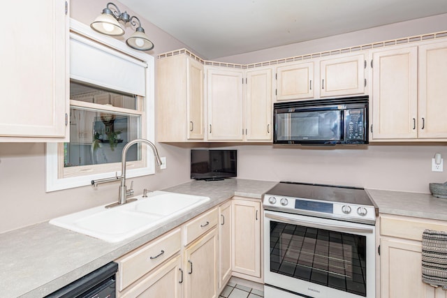 3005 Meghann Dr, Columbia, MO 65203 - kitchen with light countertops, light tile patterned flooring, a sink, and black appliances