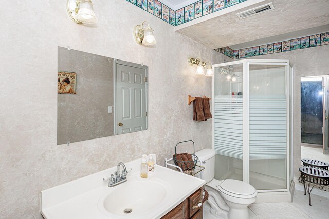 3005 Meghann Dr, Columbia, MO 65203 - bathroom featuring toilet, visible vents, a shower stall, and vanity