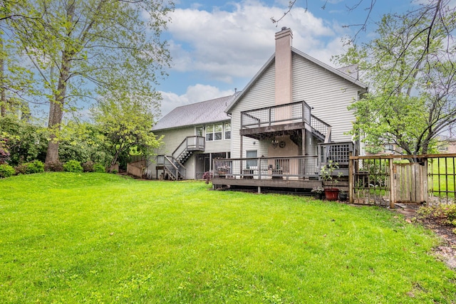 3005 Meghann Dr, Columbia, MO 65203 - back of property with fence, a deck, stairway, a chimney, and a yard