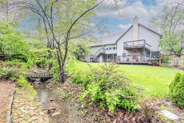 3005 Meghann Dr, Columbia, MO 65203 - view of yard with fence, stairway, and a deck