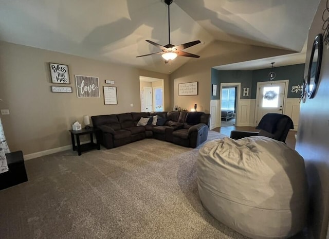 carpeted living room with a ceiling fan and lofted ceiling