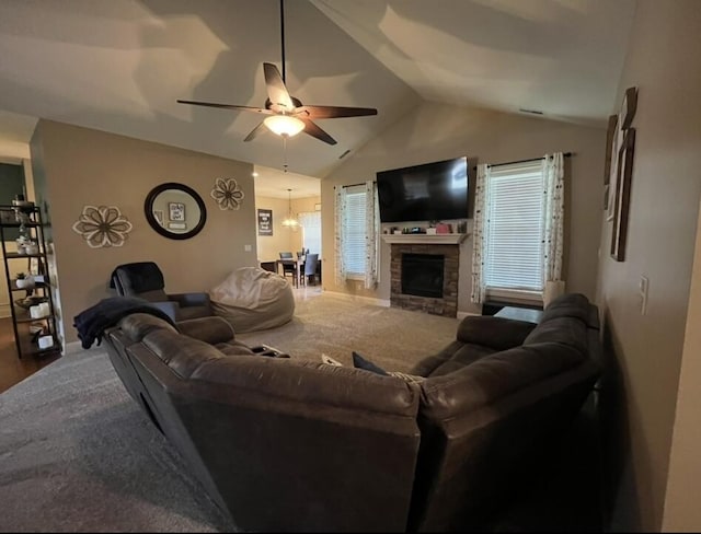 living area with baseboards, a wealth of natural light, ceiling fan with notable chandelier, and lofted ceiling