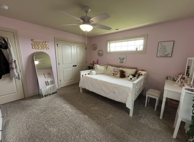 carpeted bedroom with visible vents and ceiling fan