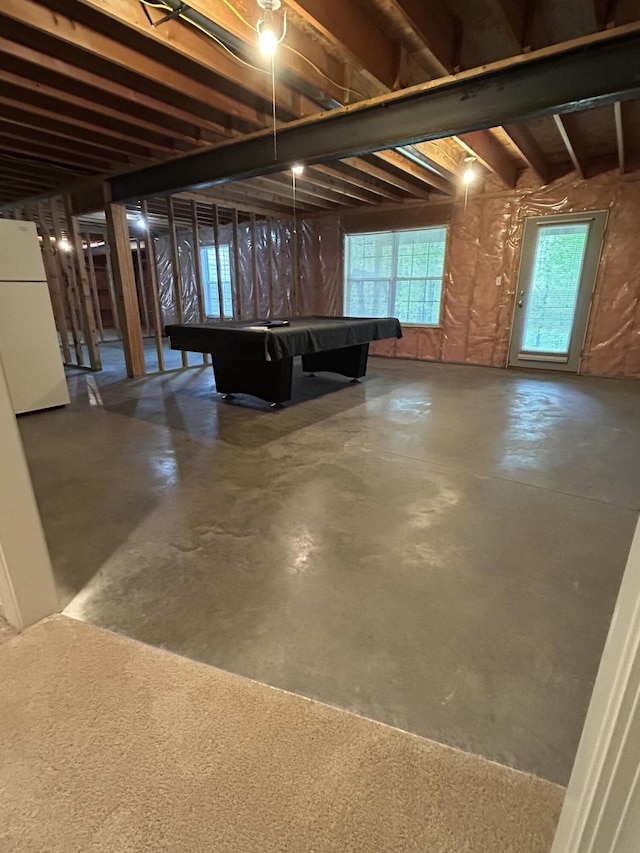 4405 Ferndale Dr, Columbia, MO 65202 - below grade area featuring pool table, plenty of natural light, and freestanding refrigerator