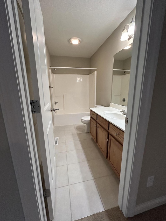 4405 Ferndale Dr, Columbia, MO 65202 - full bathroom with toilet, tile patterned floors, shower / bathing tub combination, and vanity