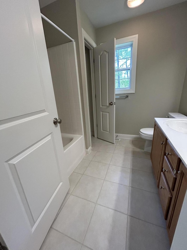 4405 Ferndale Dr, Columbia, MO 65202 - bathroom with vanity, baseboards, tile patterned floors, toilet, and  shower combination