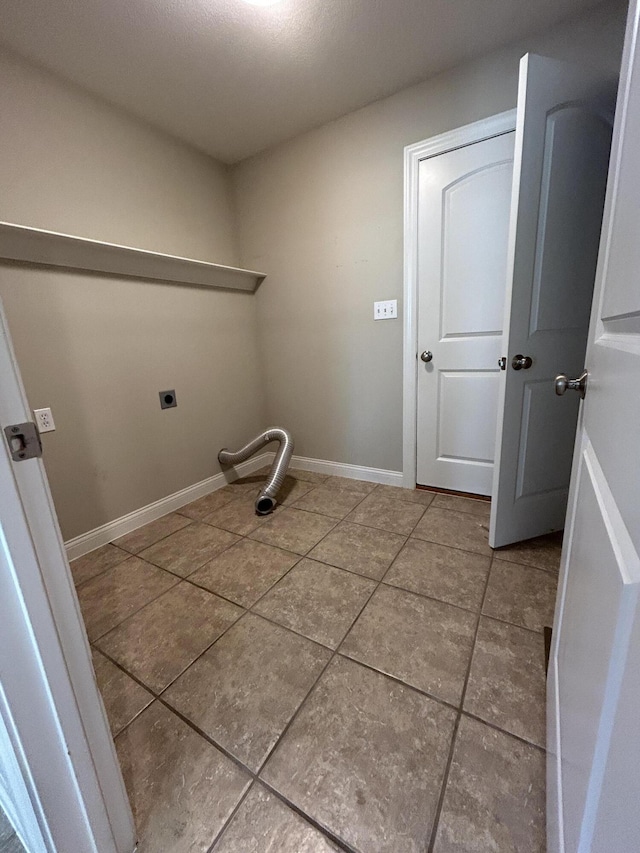 4405 Ferndale Dr, Columbia, MO 65202 - clothes washing area with tile patterned floors, baseboards, laundry area, and electric dryer hookup