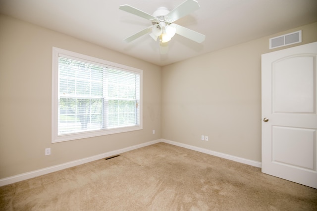 4405 Ferndale Dr, Columbia, MO 65202 - carpeted spare room featuring a ceiling fan, baseboards, and visible vents
